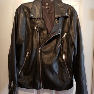 Faux black leather with zippered design. Size L.